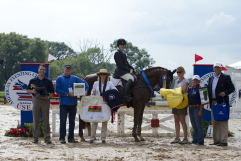 The winner of the Preliminary Amateur division Kimberly Keeton and Accolade are presented with their Amerigo Saddle from World Equestrian Brands.